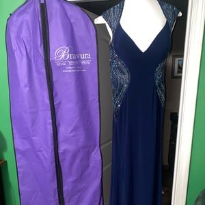 Navy blue prom dress with sparkle and open back detailing.